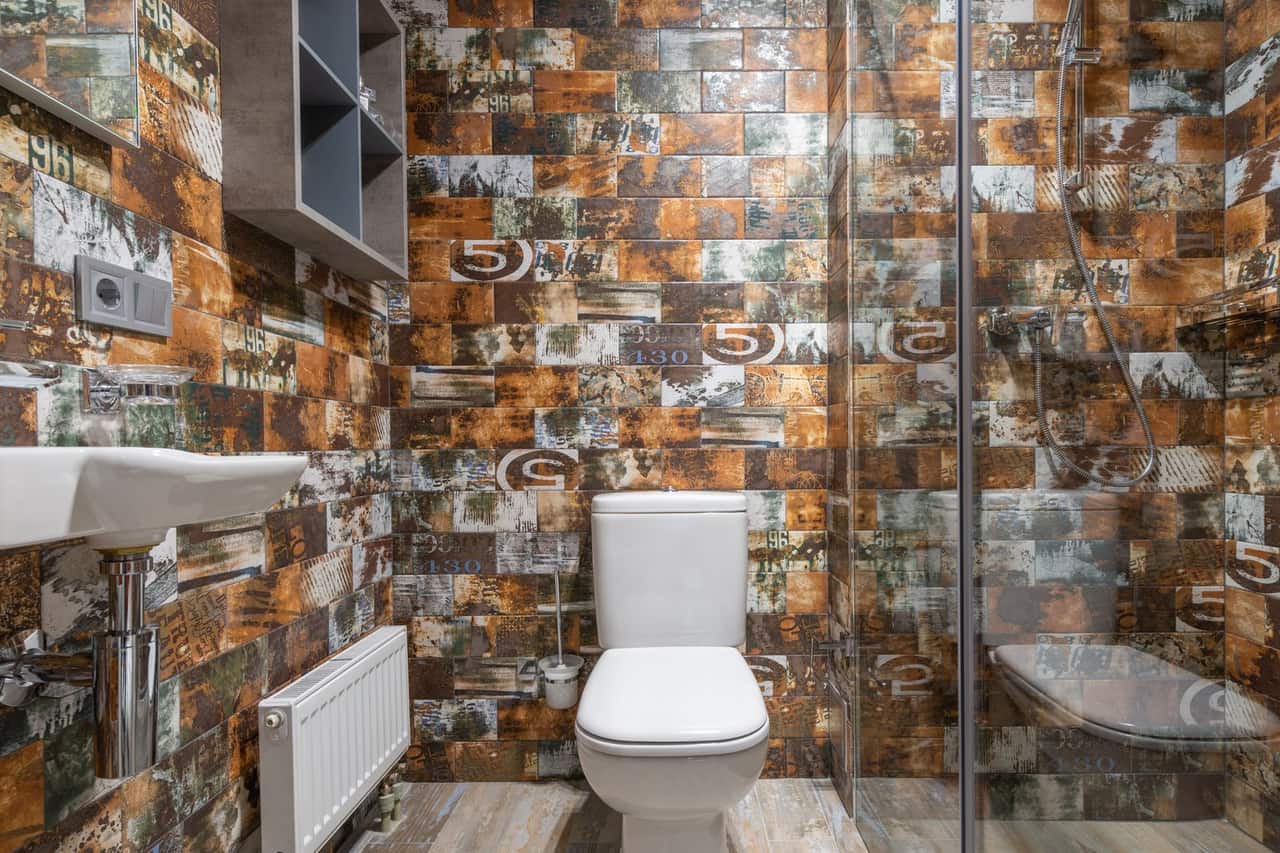 Plumber Morgantown WV: Toilet near shower cabin in bathroom