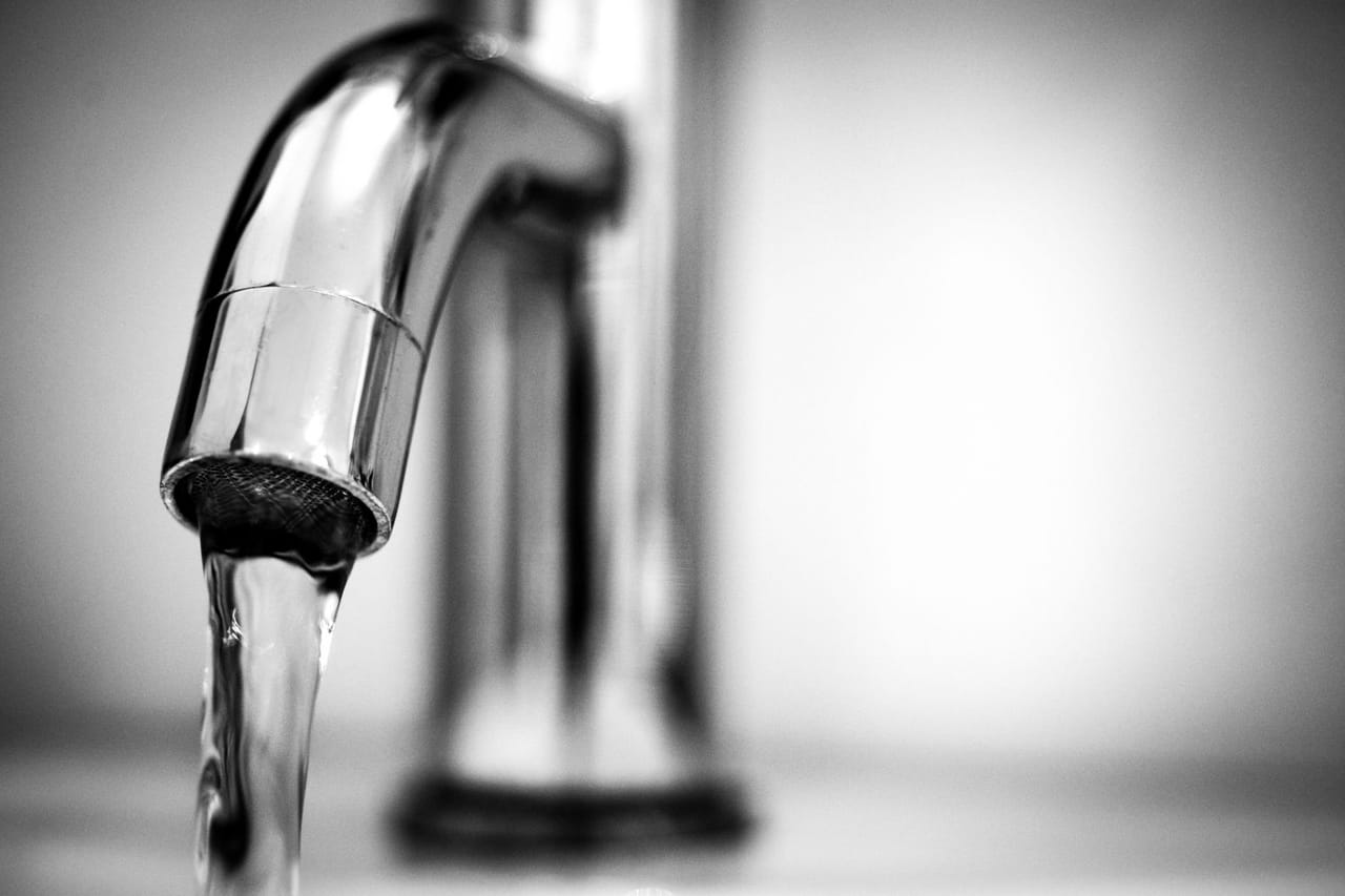Plumber Ocala FL: Macro photography of a stainless steel faucet