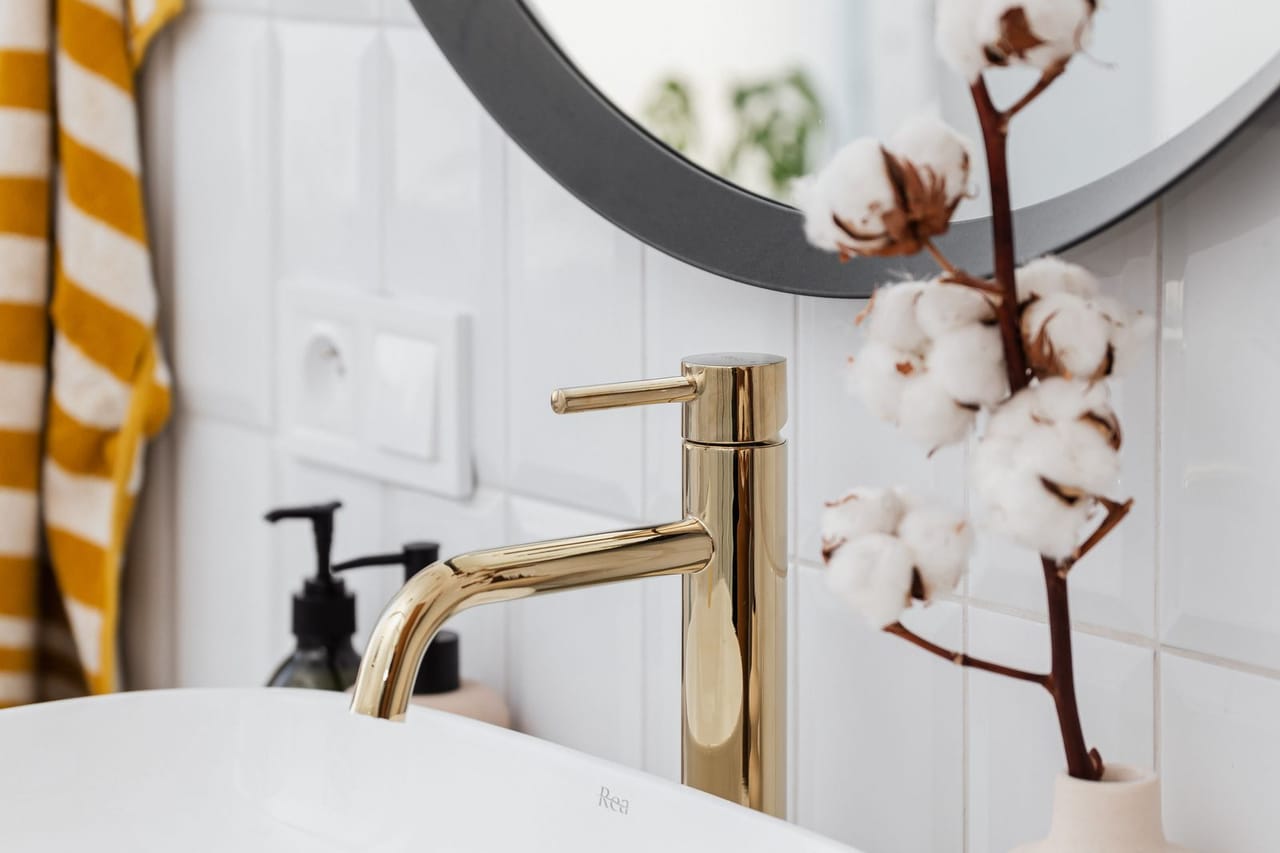 Plumber Oshkosh WI: Faucet below a mirror