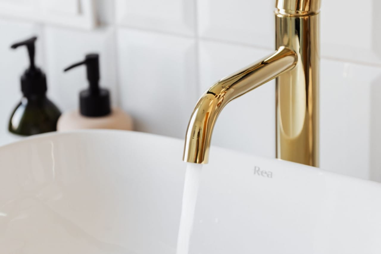 Plumber Pampa TX: Gold faucet in close up photography