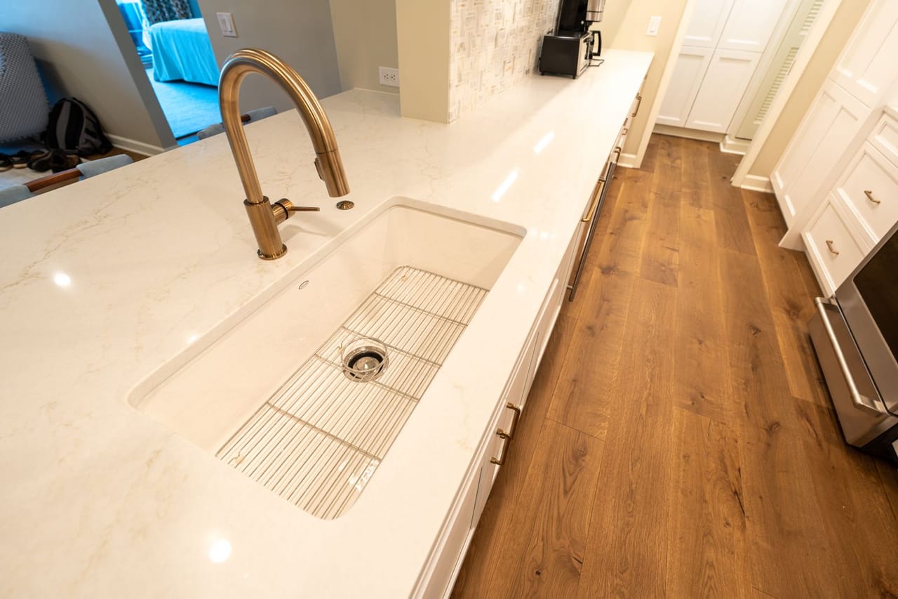 Plumber Quad Cities IA: Modern kitchen with marble countertop and sink
