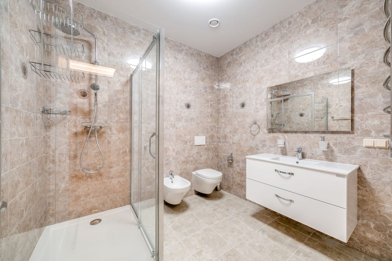 Plumber San Luis Obispo CA: A bathroom with a shower sink and toilet