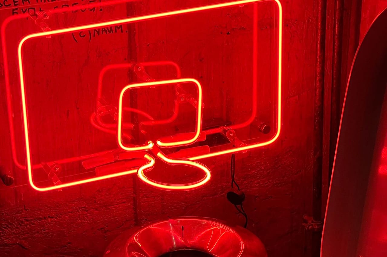 Plumber Sarasota FL: Toilet interior illuminated by neon lights