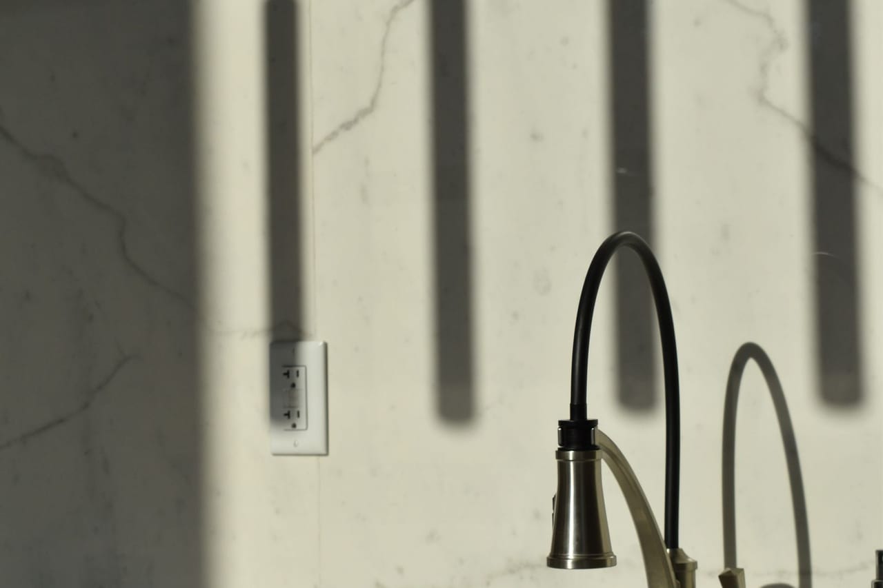 Plumber Show Low AZ: A faucet and sink in a modern kitchen