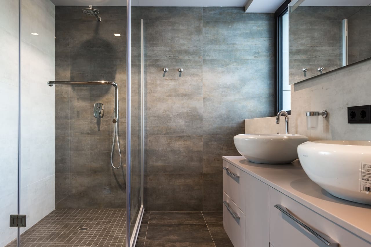 Plumber Slidell LA: A ceramic sink on top of the drawer near the shower room
