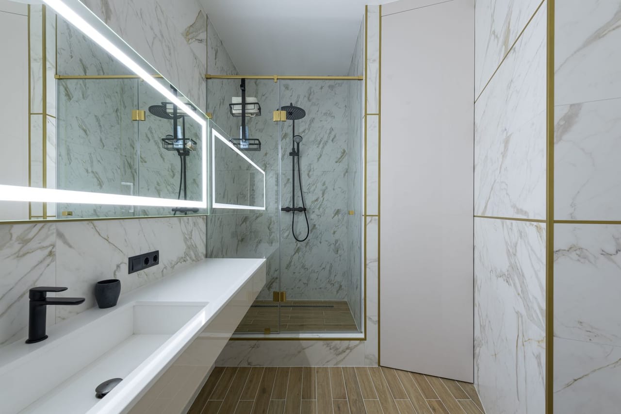 Plumber Walla Walla WA: Minimalist styled bathroom with tiled walls and shower cabin