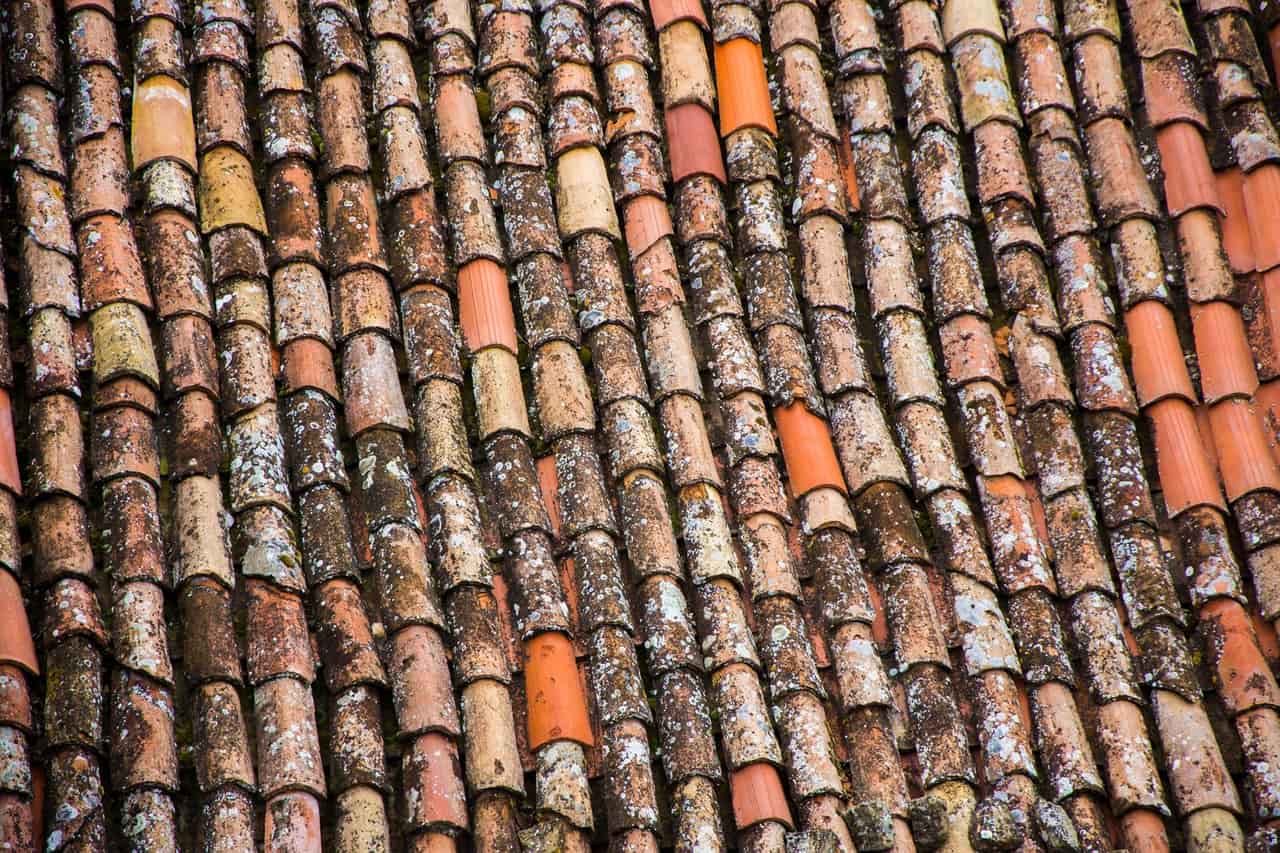 Roof repair Anaheim CA: Close up photo of old roof tiles