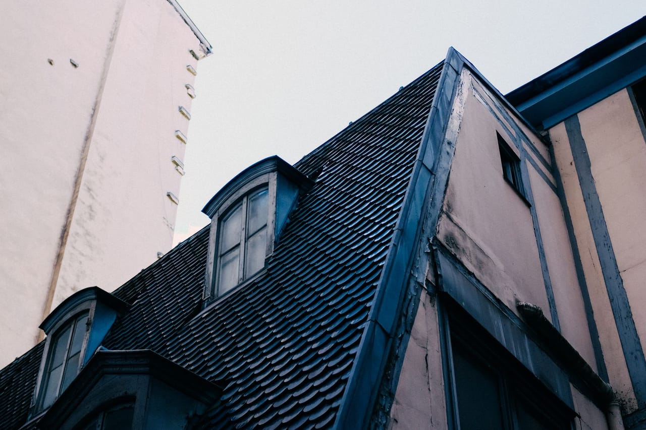 Roof repair Greeley CO: Old house roof with windows