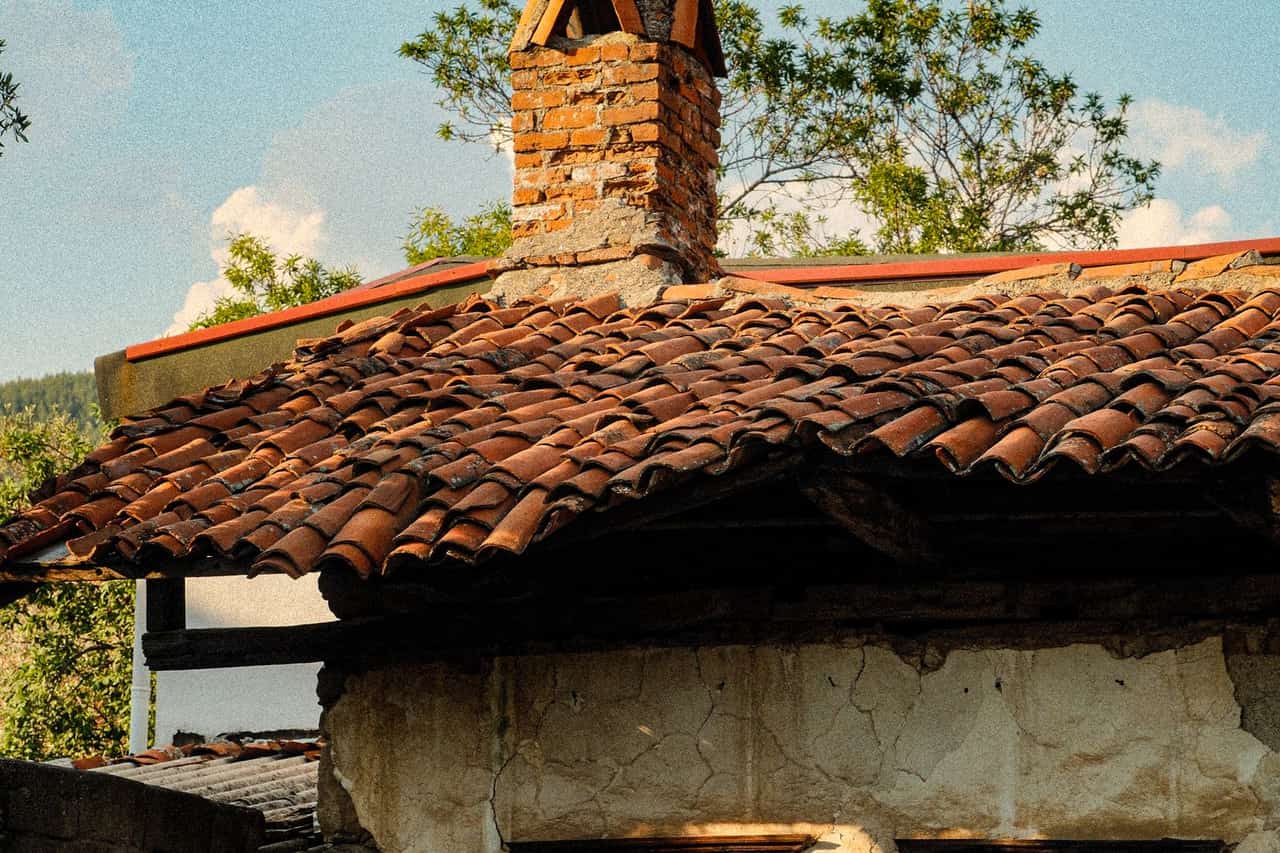 Roof repair Hayward CA: Charming rustic house with tiled roof