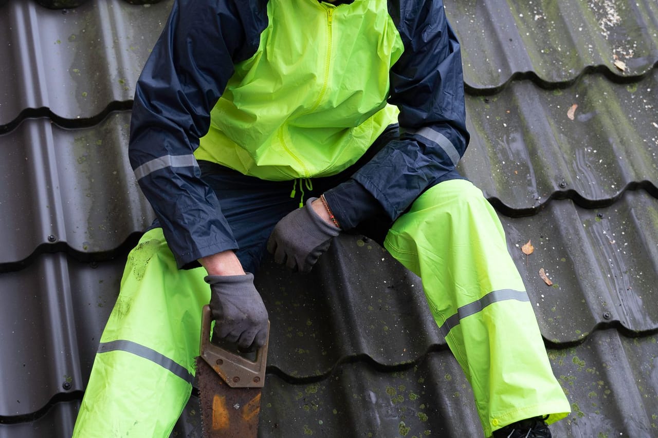 Roof repair Layton UT: A carpenter on the roof