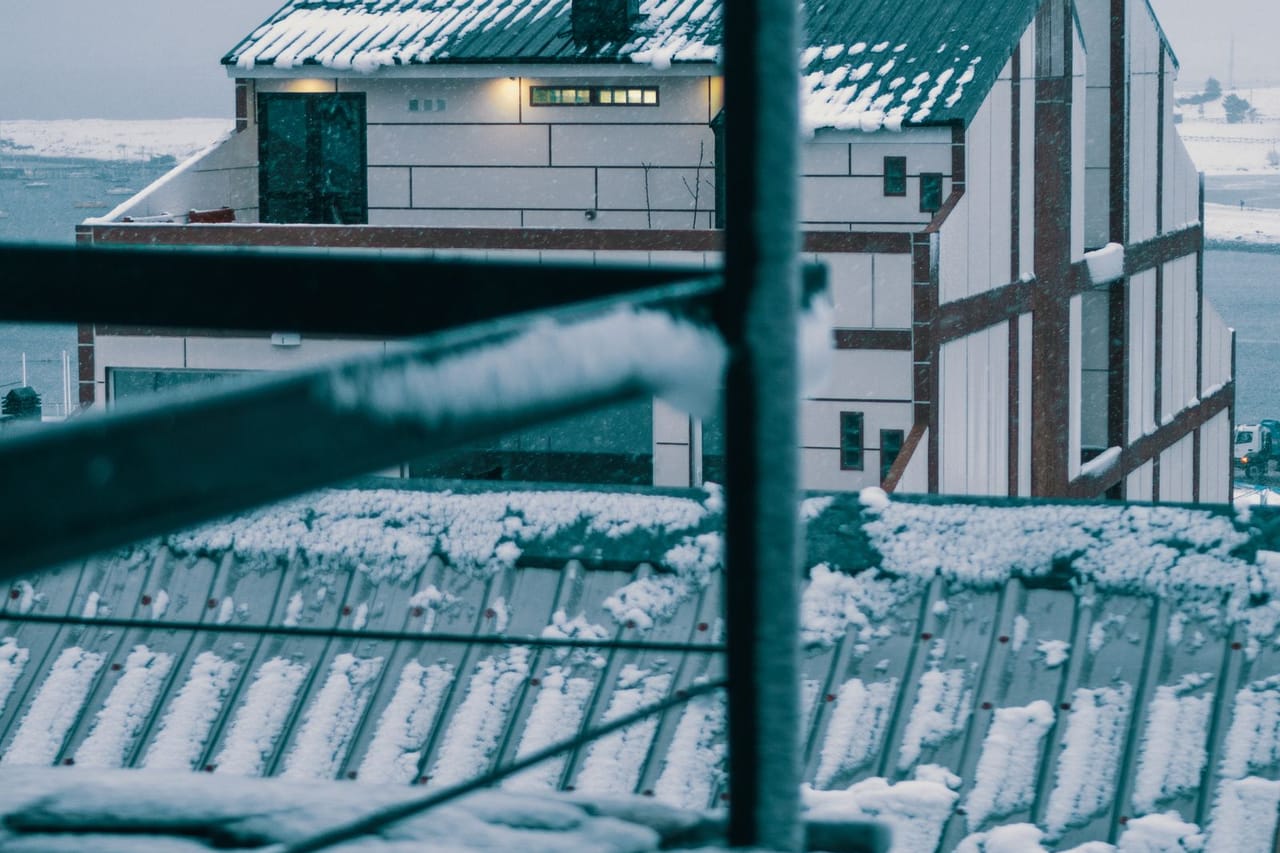 Roof repair Memphis TN: Building roofs covered with snow
