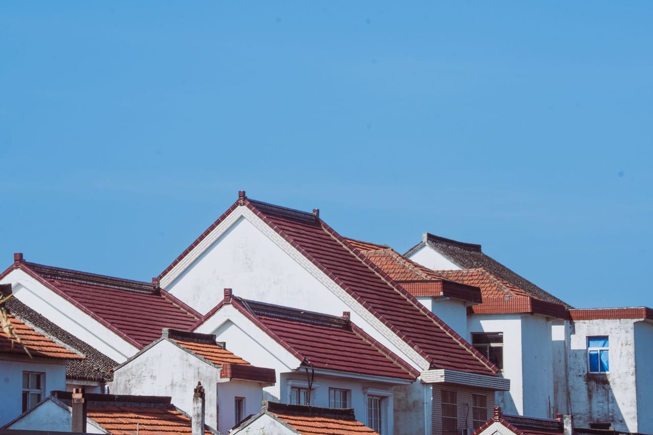 Roof repair Modesto CA: Traditional architecture with red tiled roofs