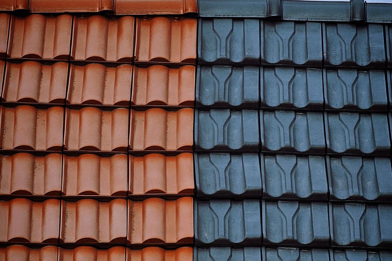 Roof repair Napa CA: Close up of red and blue tiled roofs