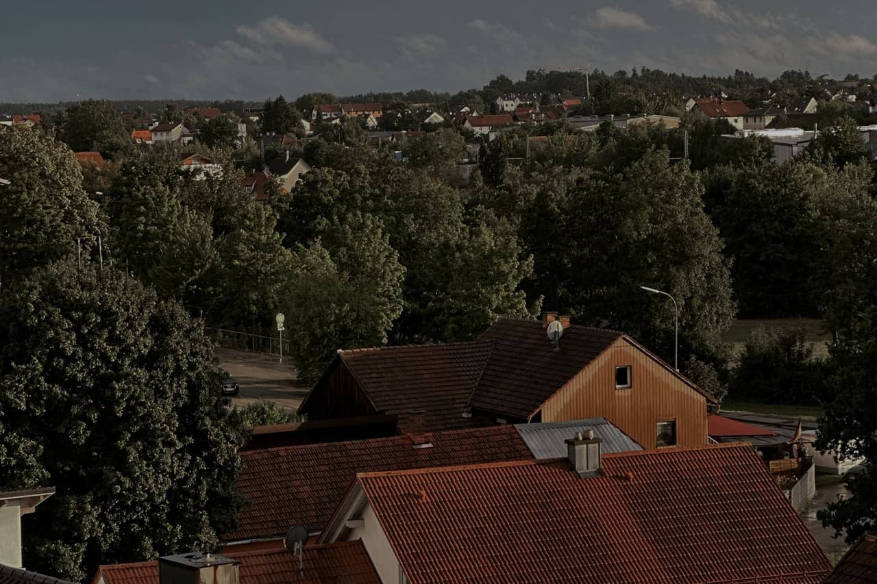 Roof repair Naples FL: Charming suburban neighborhood with red tiled roofs