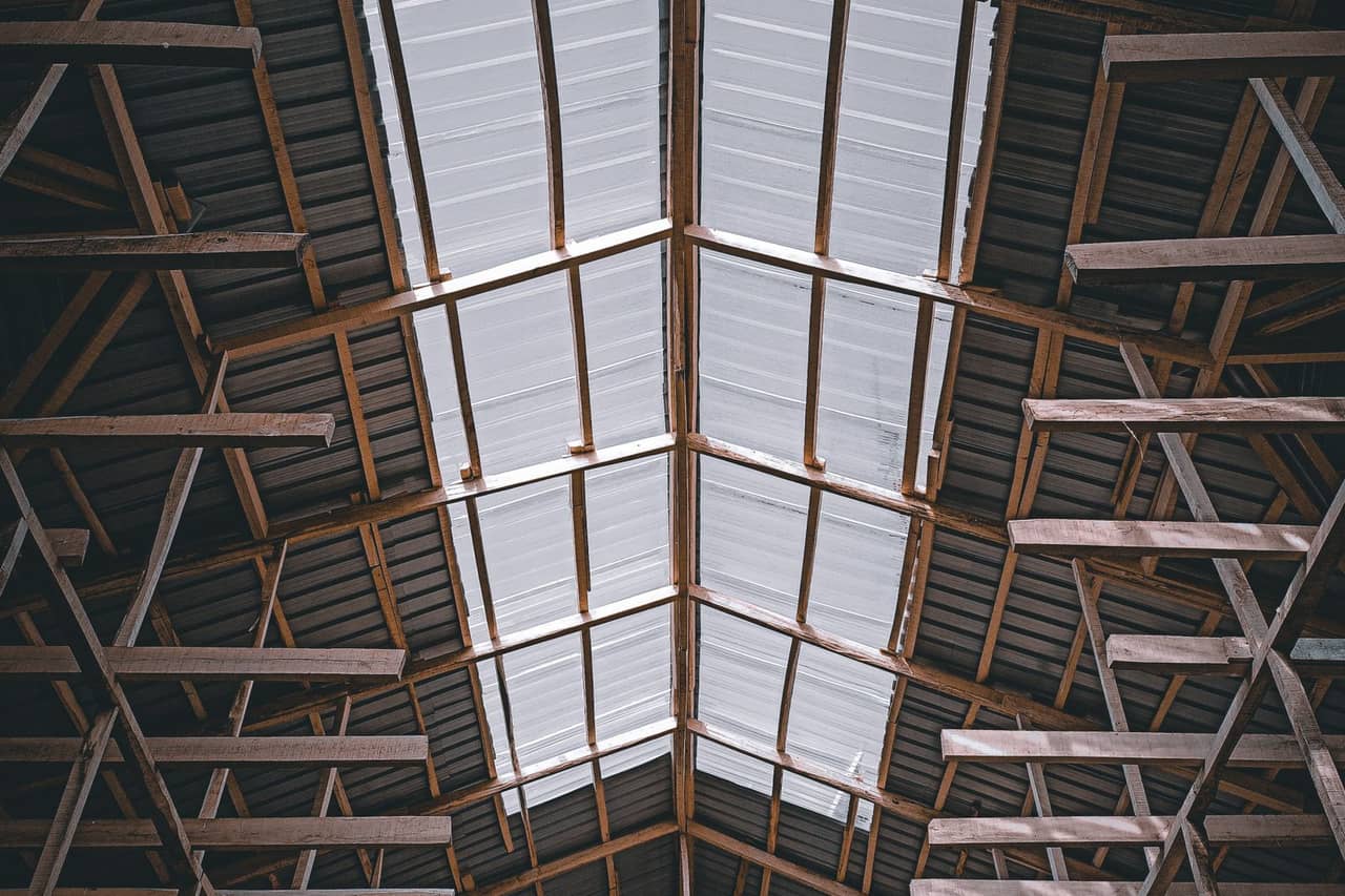 Roof repair Passaic NJ: Brown wooden ceiling with white ceiling lights