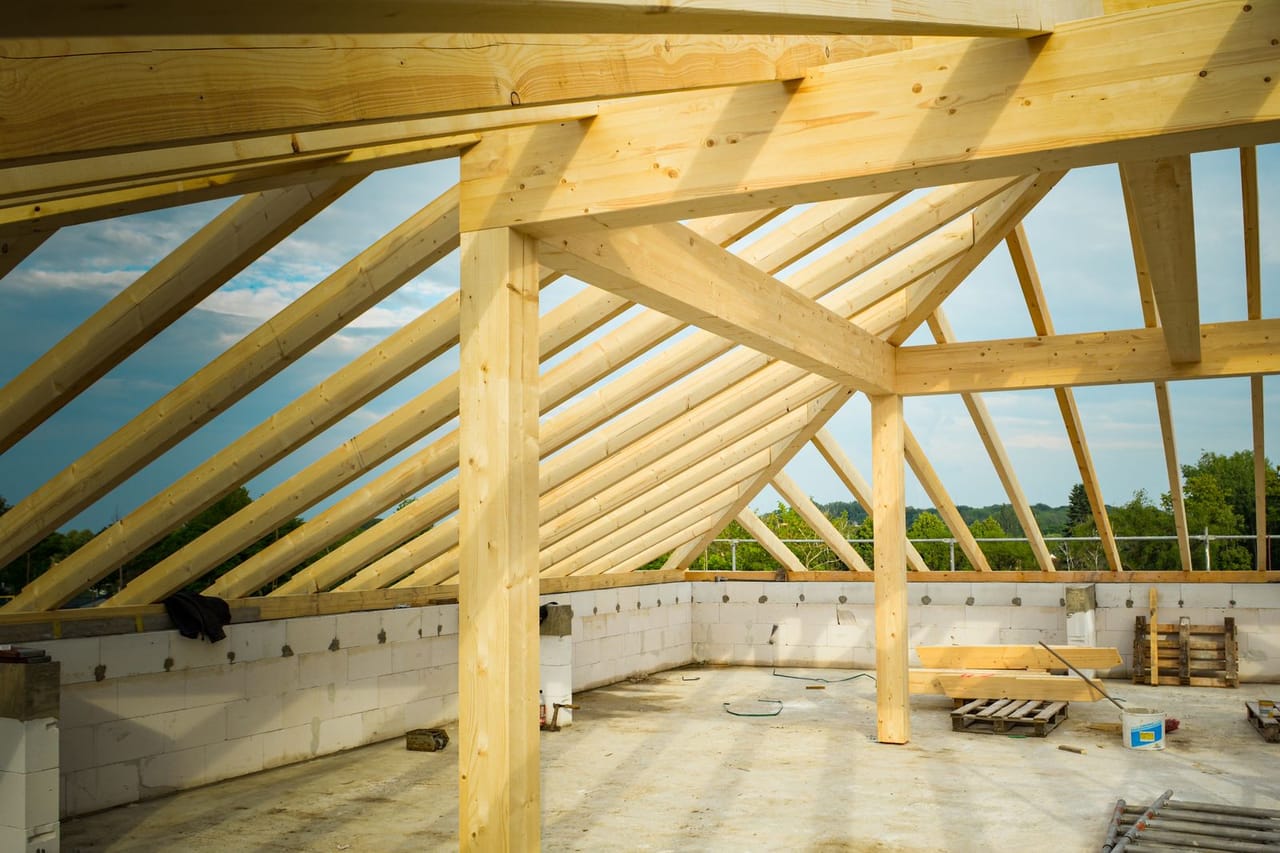 Roof repair Pearl City HI: Wooden frame of a house ceiling under construction
