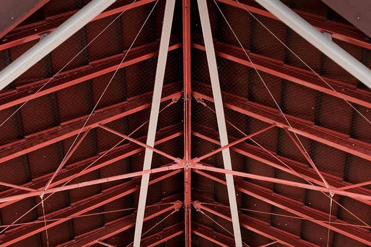 Roof repair Phoenix AZ: Low angle shot of steel trusses