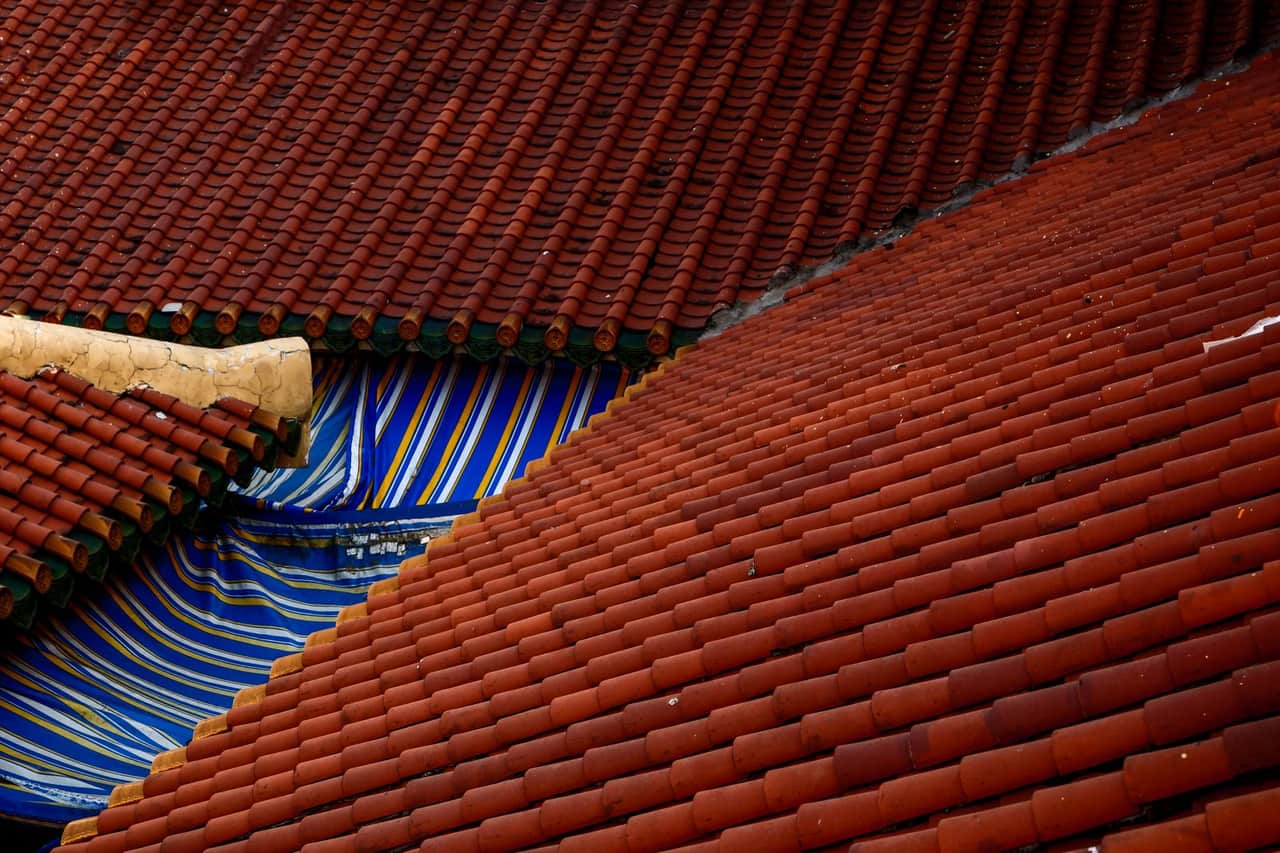 Roof repair Plano TX: Tiles on rooftops