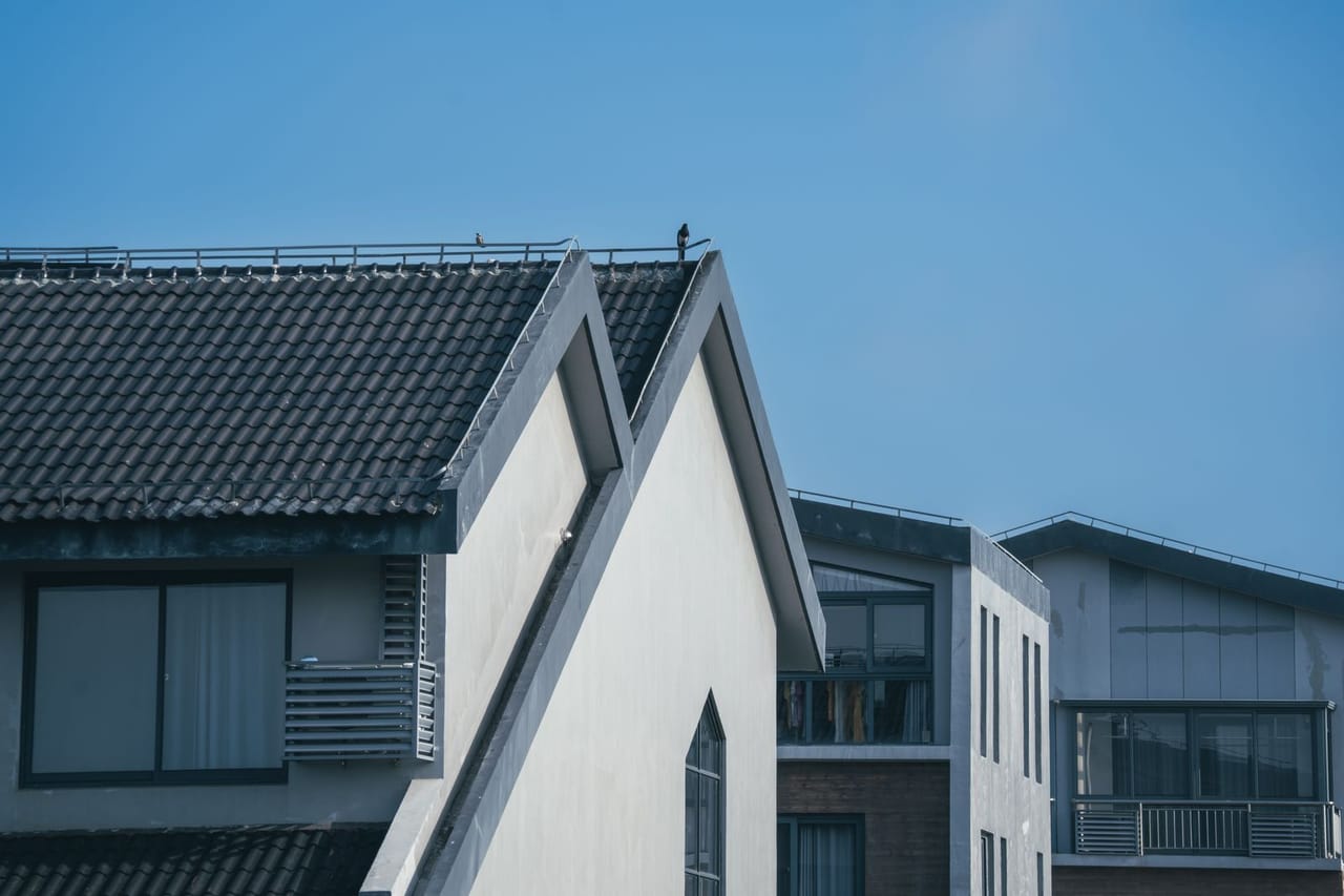 Roof repair Port St Lucie FL: Modern residential architecture under clear blue sky