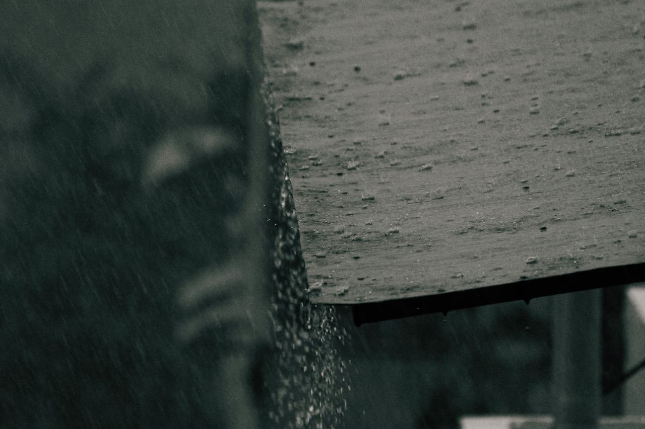 Roof repair Reading PA: Brown wooden plank under the rain