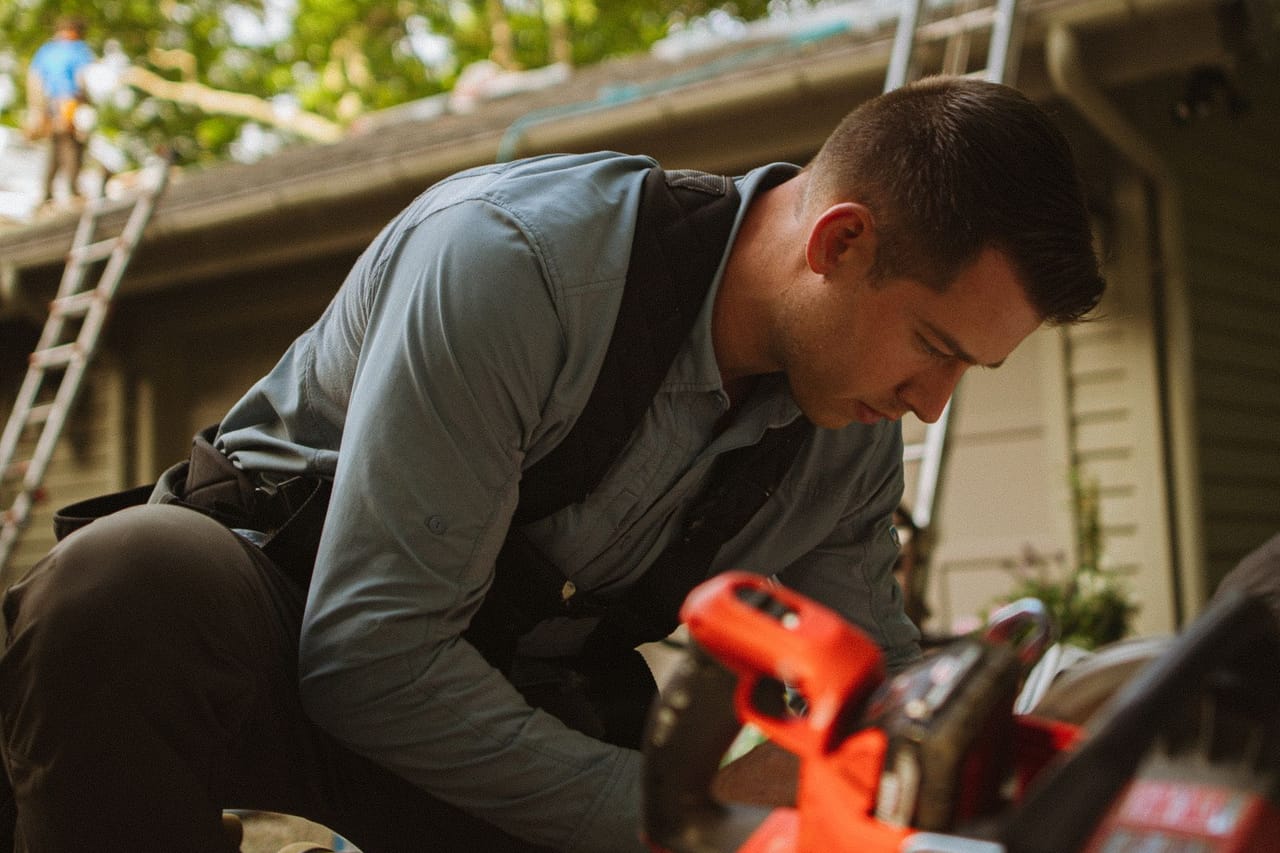 Roof repair San Angelo TX: Construction worker working outdoors on roofing project