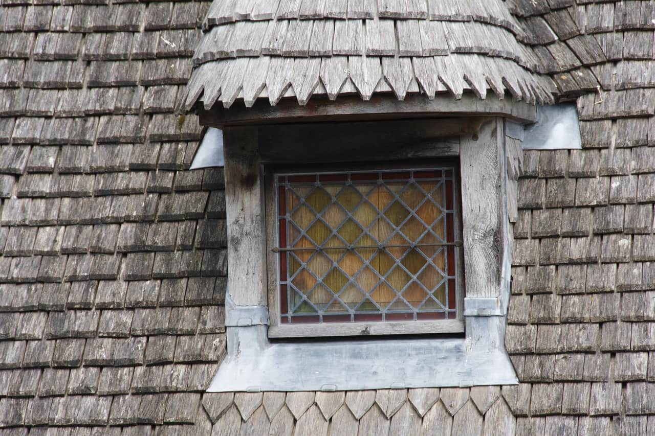 Roof repair Santa Rosa CA: Rustic dormer window on wooden shingle roof