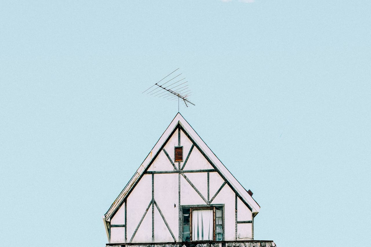Roof repair Schenectady NY: White blue and yellow house