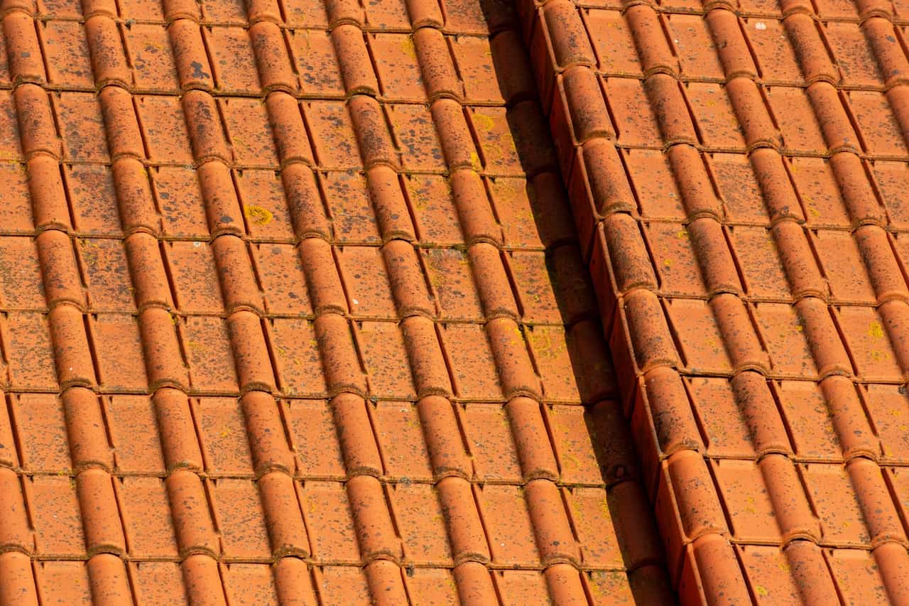 Roof repair Scranton PA: Terracotta tile rooftop with weathered texture