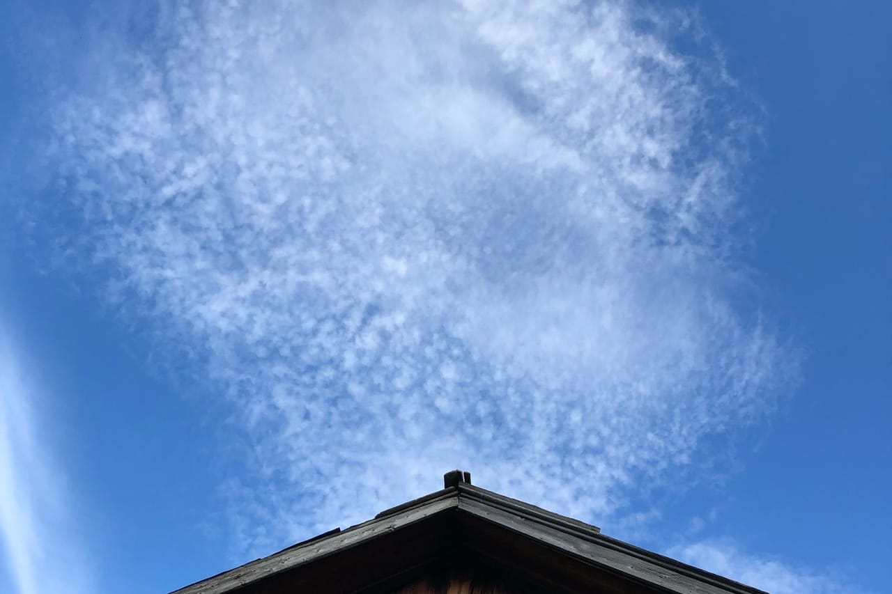 Roof repair Sedalia MO: Wooden house under blue sky