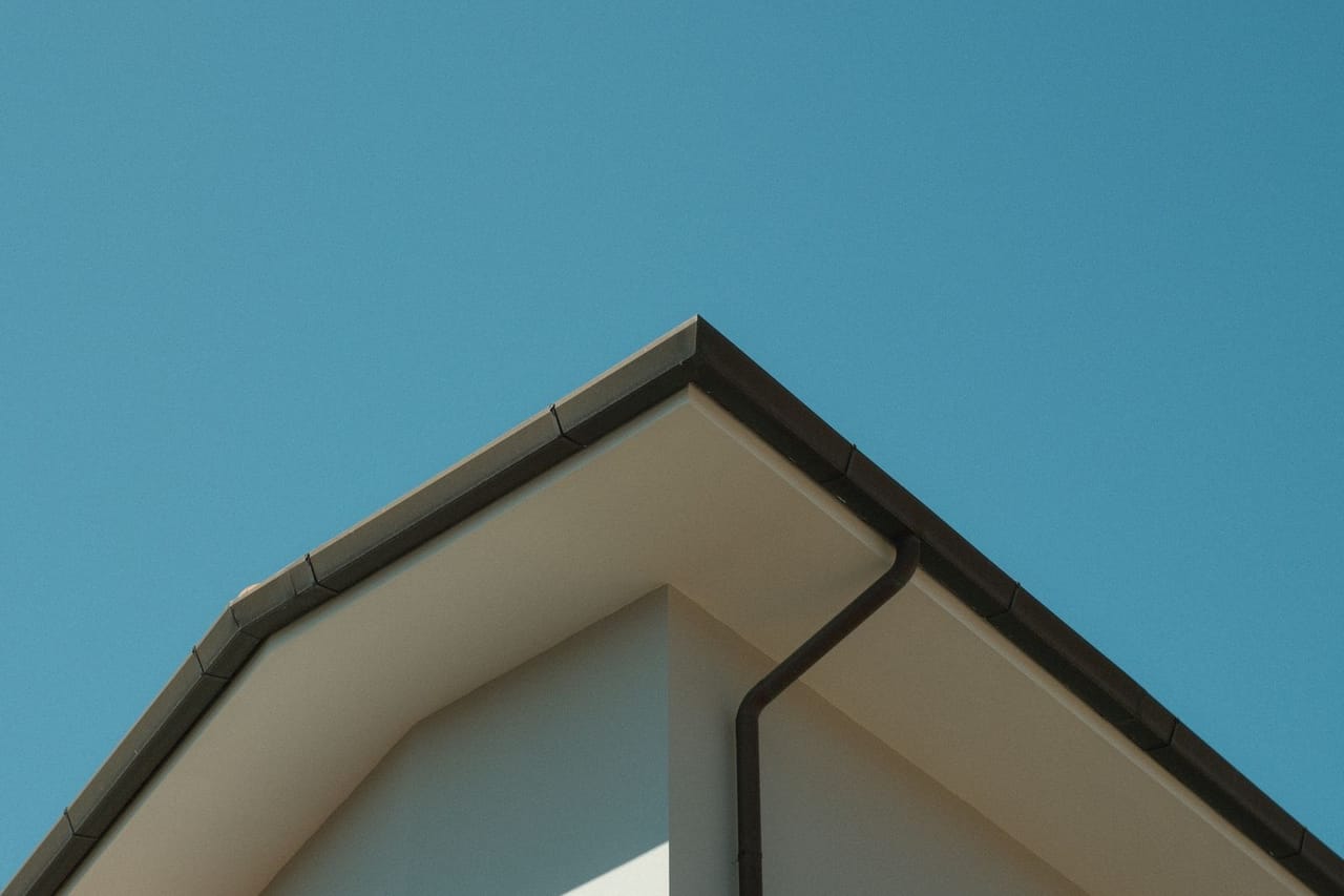 Roof repair Show Low AZ: A close up of a house with a blue sky