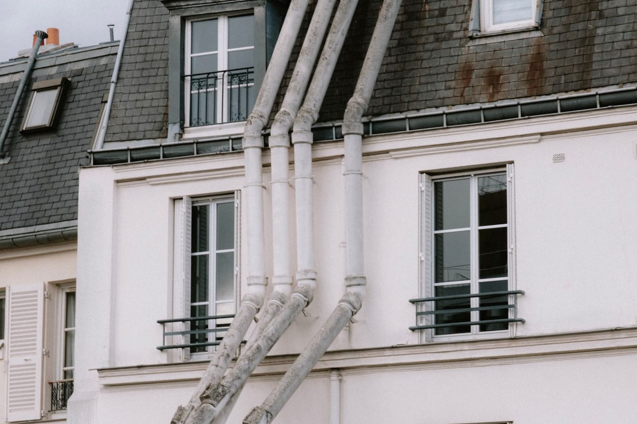 Roof repair Syracuse NY: Chimneys on tenement
