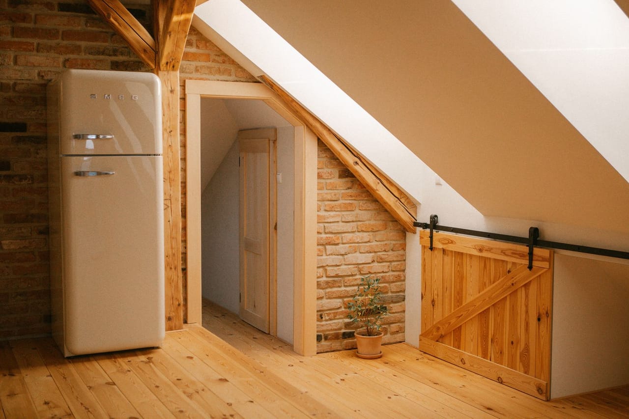 Roof repair Texas City TX: Cozy attic loft with rustic wooden details