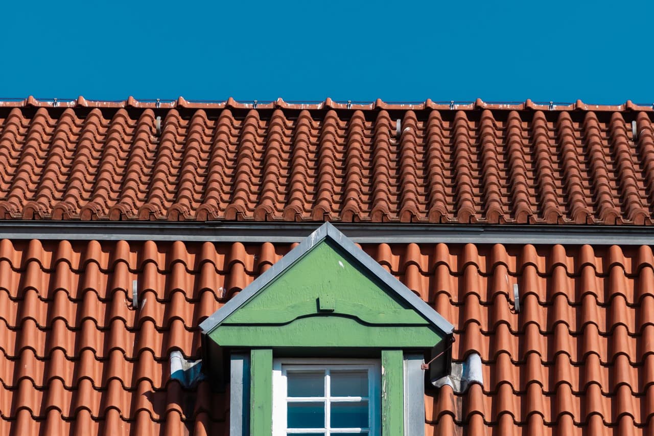 Roof repair Traverse City MI: Charming architectural detail of tiled roof