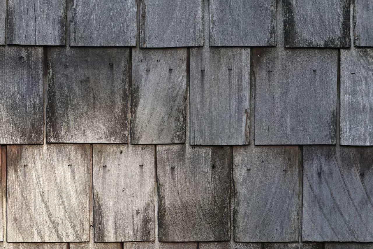 Roof repair Tukwila WA: Weathered wooden shingle texture background