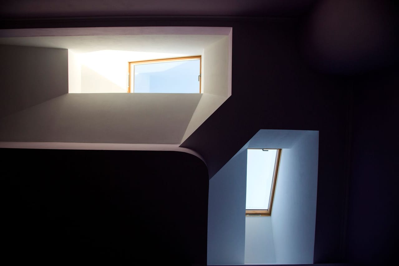 Roof repair Vallejo CA: Contemporary architectural skylights with geometric shadows