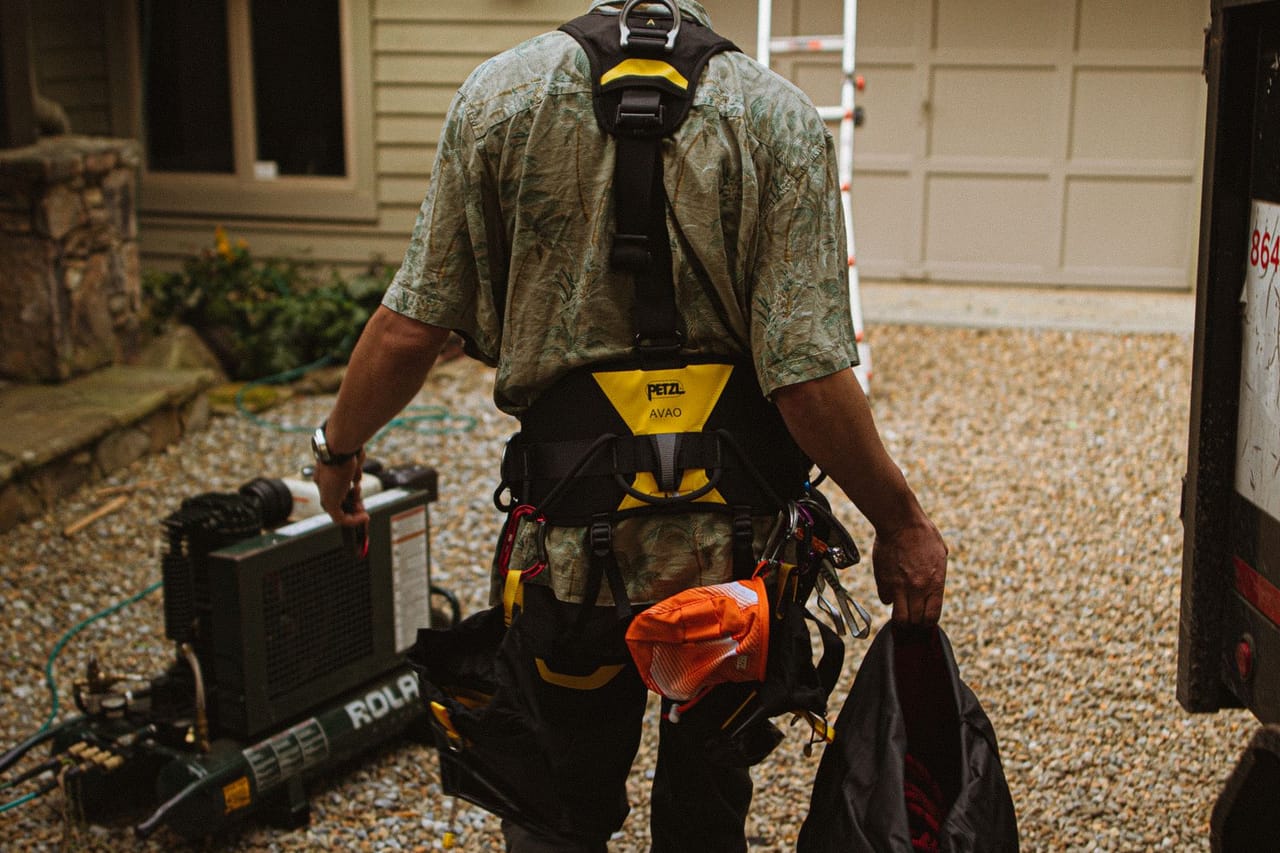 Roof repair Visalia CA: Roofer at work on residential building site