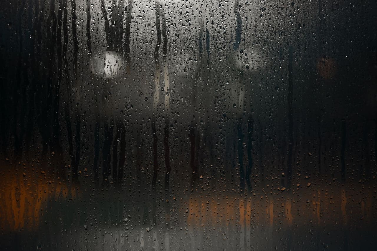 Water damage restoration Burlington VT: Water droplets on foggy glass