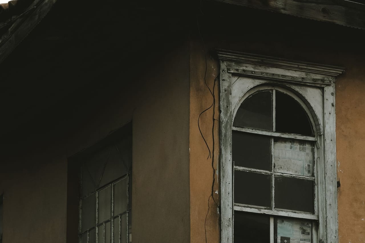 Water damage restoration Harrisonburg VA: Broken wall with wooden framed glass window