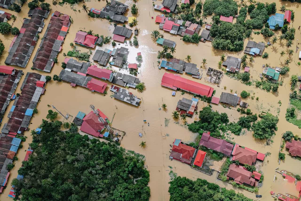 Water damage restoration Long Beach CA: Flooded small village with houses