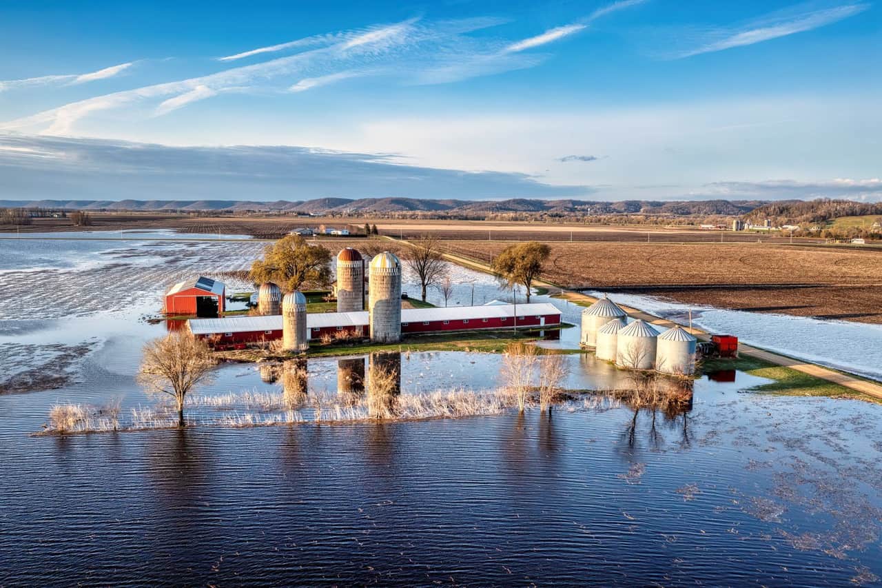 Water damage restoration Mckinney TX: Farm buildings among fields