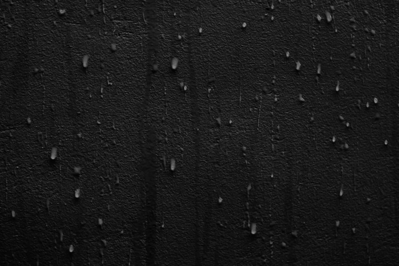 Water damage restoration Palo Alto CA: Rain drops on a black wall