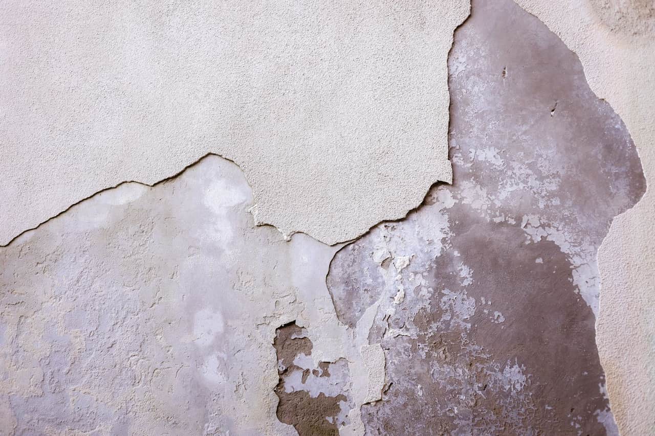 Water damage restoration Pampa TX: Detailed textured cracked wall surface