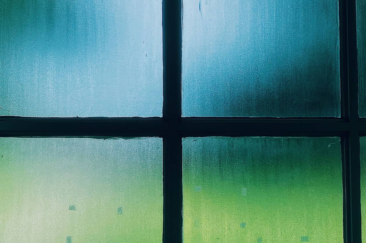 Water damage restoration Redding CA: Glass window with dew
