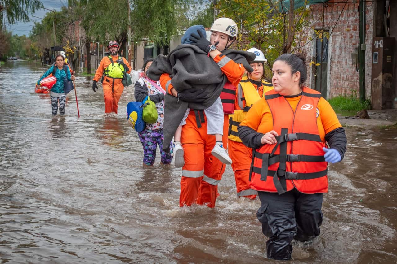 Water damage restoration Tulsa OK: Rescue team assisting flood victims in action