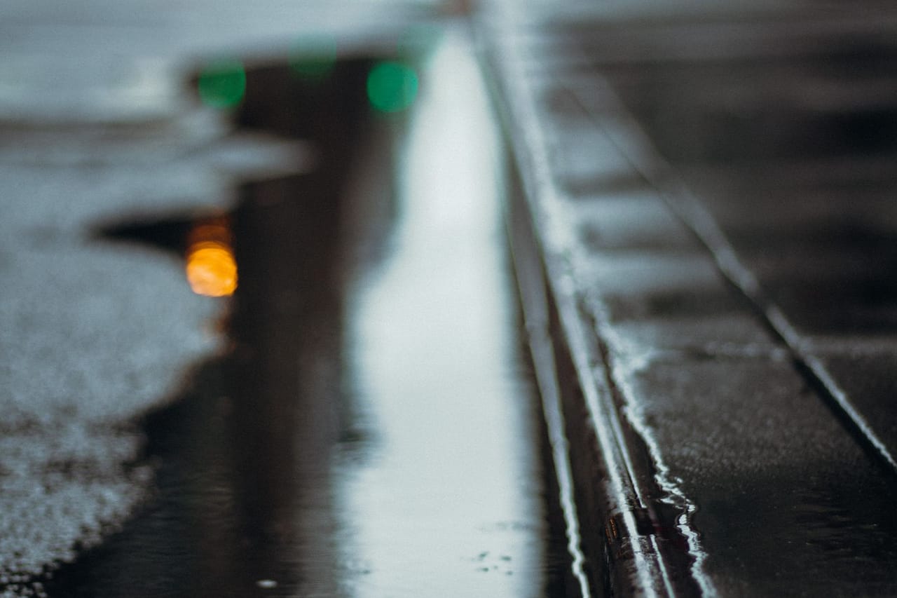 Water damage restoration Walnut Creek CA: Wet asphalt after rain in evening time