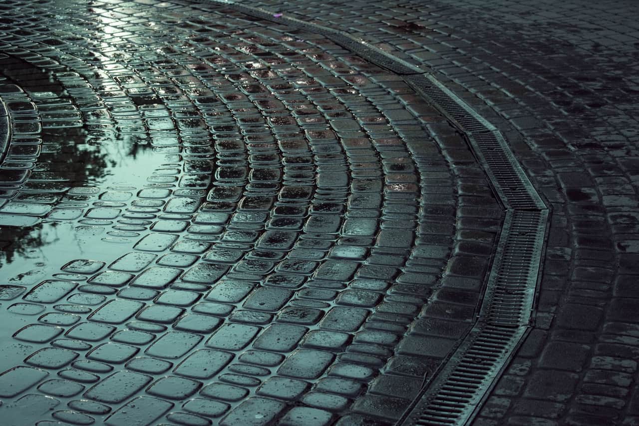 Water damage restoration Waukegan IL: Wet cobblestone road
